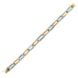 AN AQUAMARINE BRACELET in high carat yellow gold comprising a single row of seven emerald cut