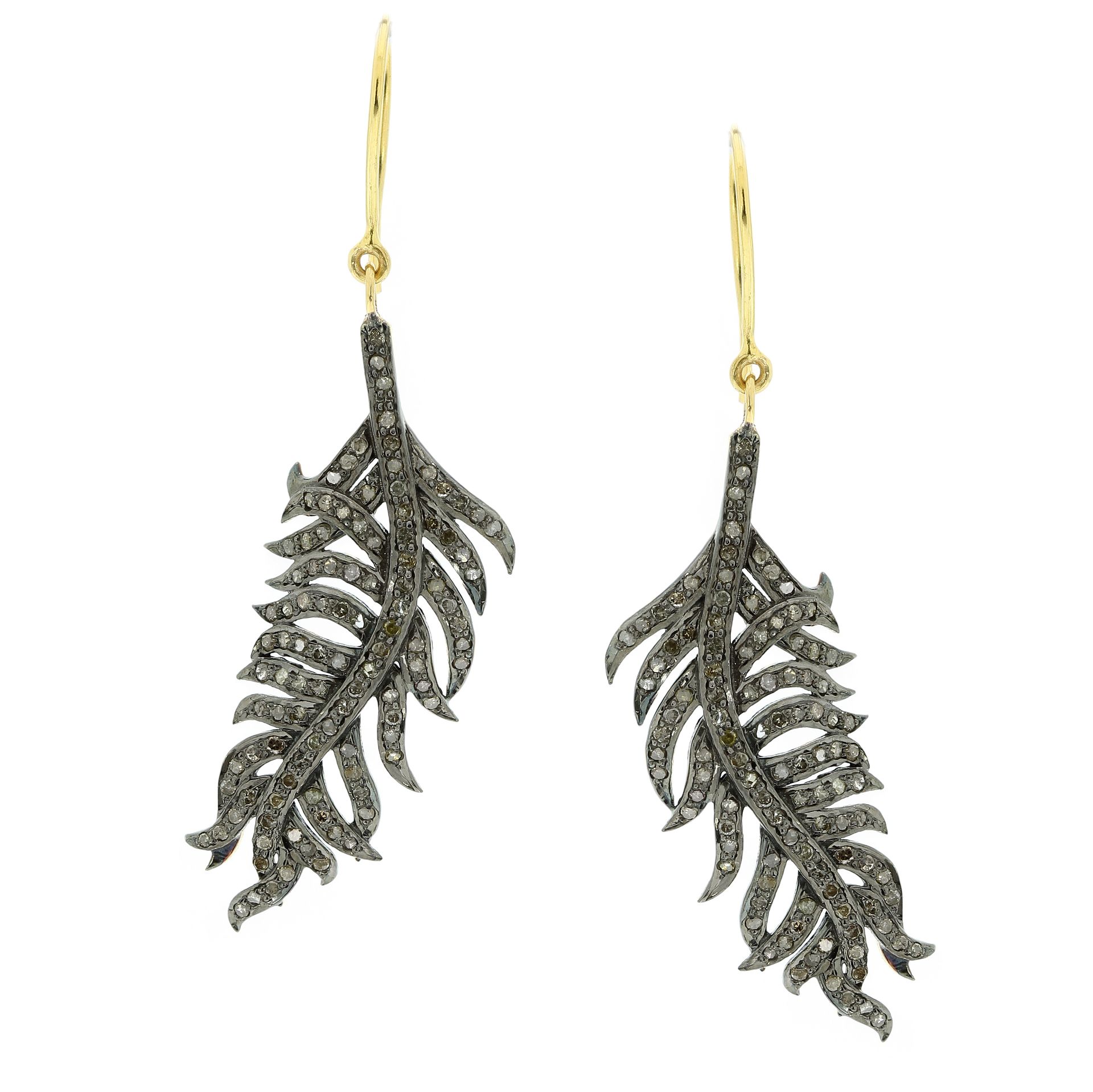 A PAIR OF DIAMOND FEATHER EARRINGS in yellow gold and silver, each designed as a feather, jewelled
