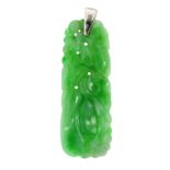 A CARVED JADEITE JADE PENDANT formed of a tapering carved piece of jade with floral patterns,