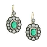 A PAIR OF ANTIQUE EMERALD AND DIAMOND CLUSTER EARRINGS, CIRCA 1910 in yellow gold and silver, each