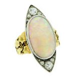 AN ART NOUVEAU OPAL AND DIAMOND DRESS RING in 18ct white gold and platinum, set with an oval