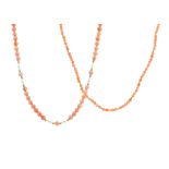 TWO CORAL BEAD NECKLACES one comprising a single row of sixty five polished coral beads with gold