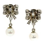 A PAIR OF PEARL AND DIAMOND DROP EARRINGS in white gold or platinum, each suspending a pearl of 7.
