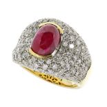 AN UNHEATED RUBY AND DIAMOND DRESS RING in 18ct yellow gold, set with a central oval cabochon ruby