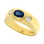 A SAPPHIRE AND DIAMOND THREE STONE RING in 18ct yellow gold, designed as a wide gold band set with a