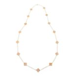 A CORAL ALHAMBRA STYLE FANCY LINK NECKLACE in 18ct yellow gold, in the manner of Van Cleef & Arpels,