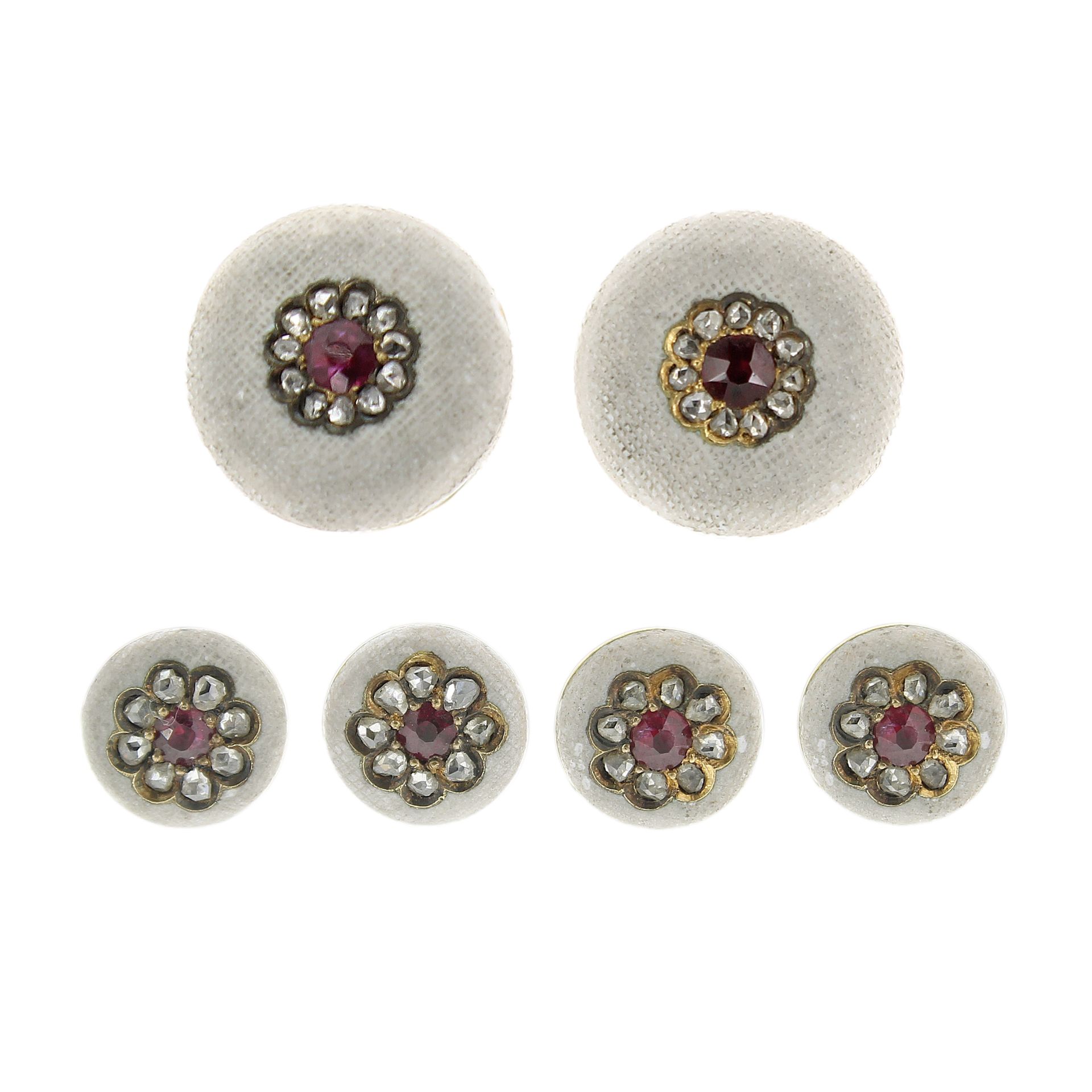 A RUBY AND DIAMOND DRESS SET in 18ct yellow gold, formed of cufflinks and button studs, each with