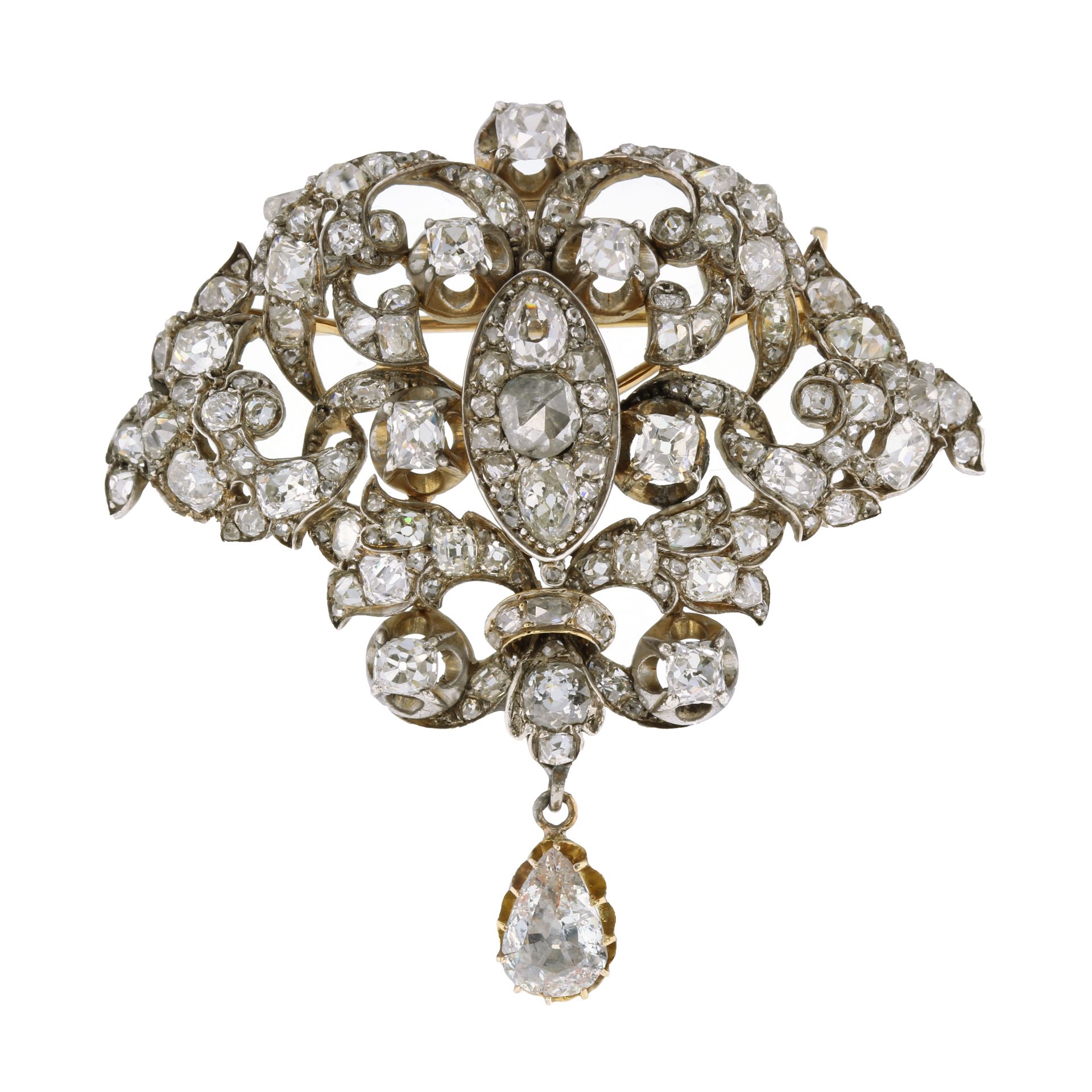 AN ANTIQUE DIAMOND BROOCH, CIRCA 1870 in high carat yellow gold and silver, the foliate scroll