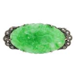 AN ANTIQUE JADEITE JADE AND DIAMOND BROOCH set with an elongated oval piece of jade carved in detail