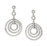 A PAIR OF DIAMOND EARRINGS in 18ct white gold, each formed of a trio of articulated concentric