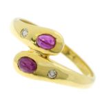 A RUBY AND DIAMOND SNAKE RING in 18ct yellow gold formed as the body of a snake, coiled around