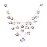 AN ANTIQUE AMETHYST AND SEED PEARL NECKLACE, CIRCA 1800 set with graduated oval cut amethysts