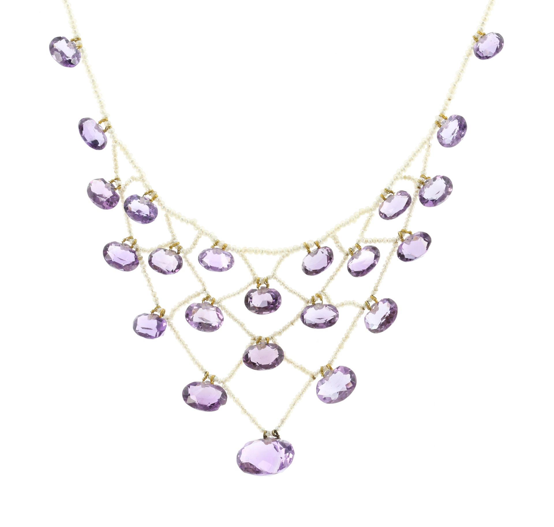 AN ANTIQUE AMETHYST AND SEED PEARL NECKLACE, CIRCA 1800 set with graduated oval cut amethysts