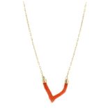 A CORAL WISHBONE NECKLACE in 14ct yellow gold, the naturalistic coral body capped with gold mounts