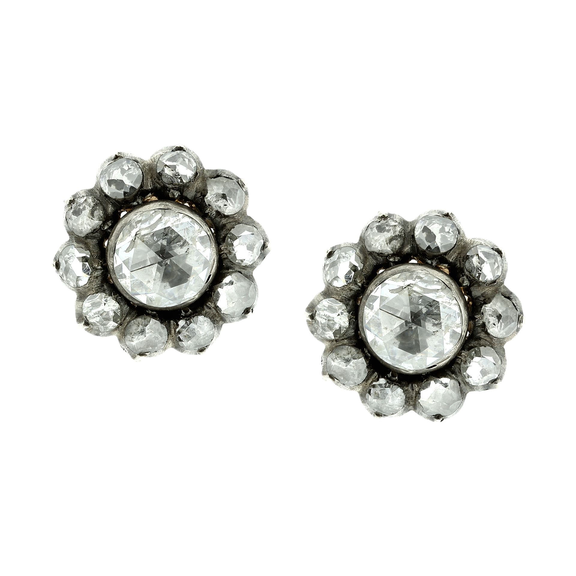 A PAIR OF ANTIQUE DIAMOND CLUSTER EARRINGS in high carat yellow gold and silver each set with a