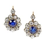 A PAIR OF SAPPHIRE AND DIAMOND CLUSTER EARRINGS in high carat yellow gold and silver, each set