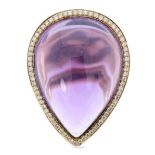 AN AMETHYST AND DIAMOND COCKTAIL RING in 18ct rose gold, set with a large pear shaped cabochon