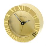 A VINTAGE BRASS 'ATLAS' ALARM CLOCK, TIFFANY & CO of circular form, with polished Roman numerals