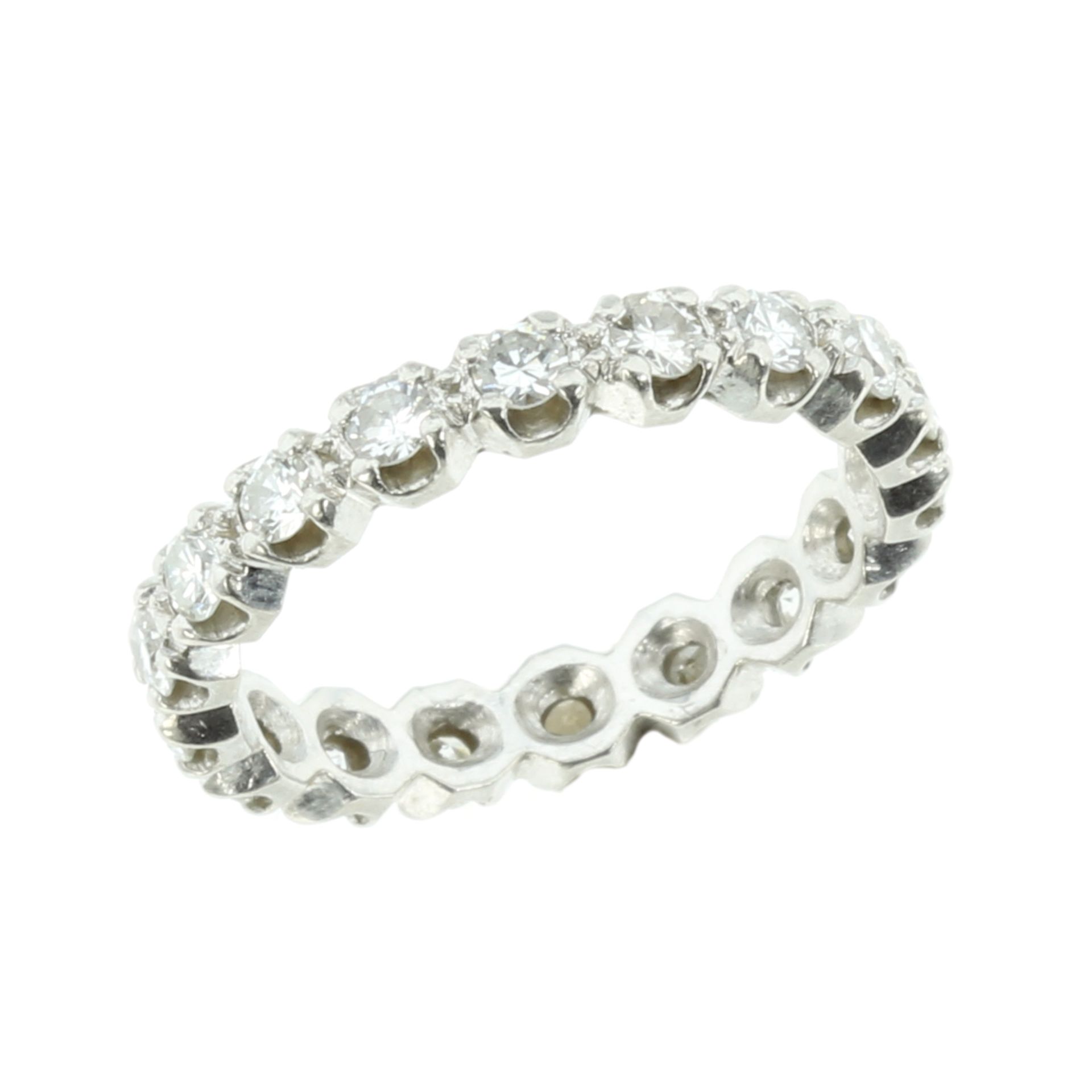 A 1.35 CARAT DIAMOND ETERNITY RING in platinum comprising a single row of round cut diamonds