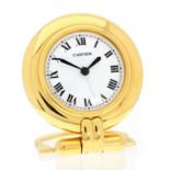 A VINTAGE TRAVEL / DESK CLOCK, CARTIER CIRCA 1980 24 carat gold plated, of circular form with a