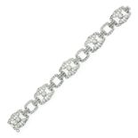 AN ANTIQUE DIAMOND BRACELET in white gold or platinum, comprising five fancy links, each set with