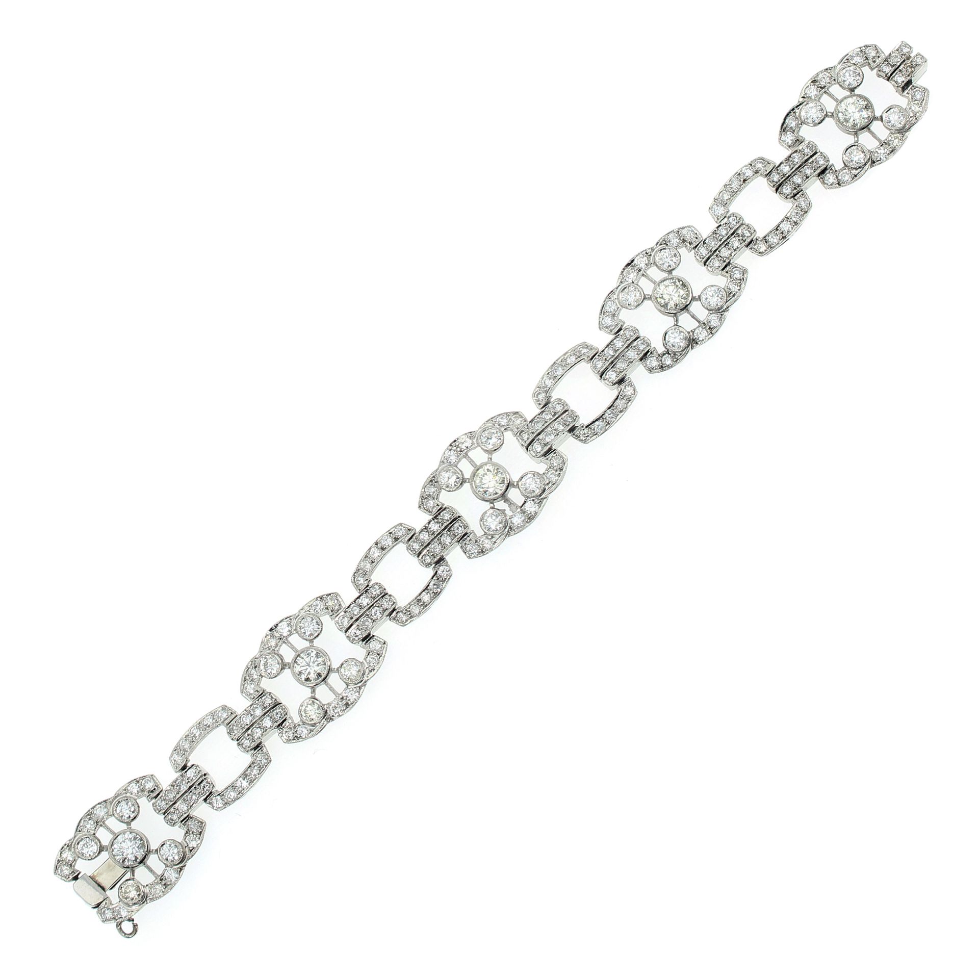 AN ANTIQUE DIAMOND BRACELET in white gold or platinum, comprising five fancy links, each set with
