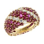 A RUBY AND DIAMOND DRESS RING in high carat yellow gold, the graduated band jewelled all over with