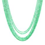 A FACETED EMERALD BEAD NECKLACE comprising six rows of faceted emerald beads totalling approximately