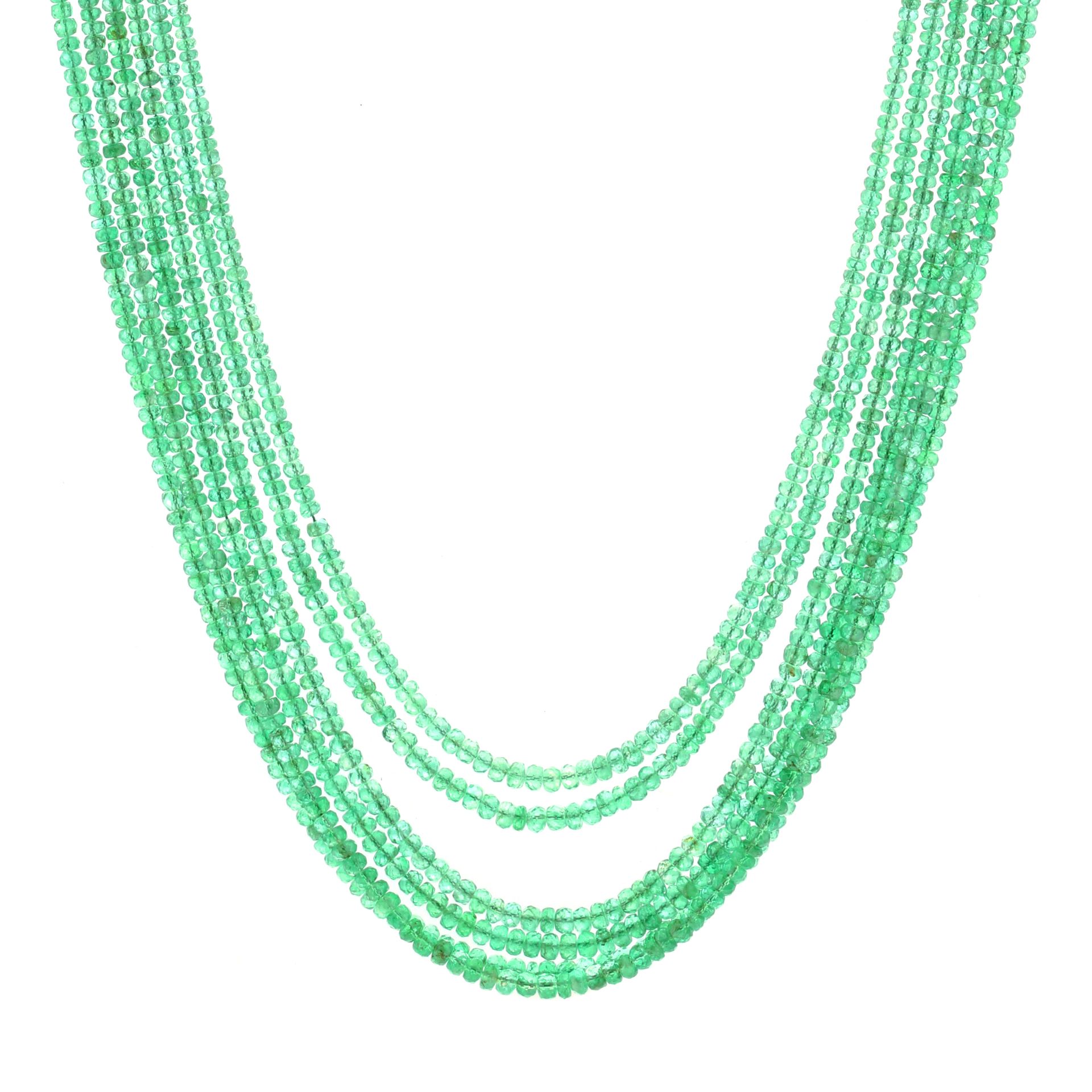 A FACETED EMERALD BEAD NECKLACE comprising six rows of faceted emerald beads totalling approximately