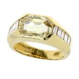 A CITRINE AND DIAMOND DRESS RING in 18ct yellow gold, set with an emerald cut citrine flanked in