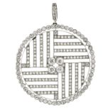 AN ANTIQUE ART DECO DIAMOND PENDANT in white gold or platinum of circular form, set at the centre