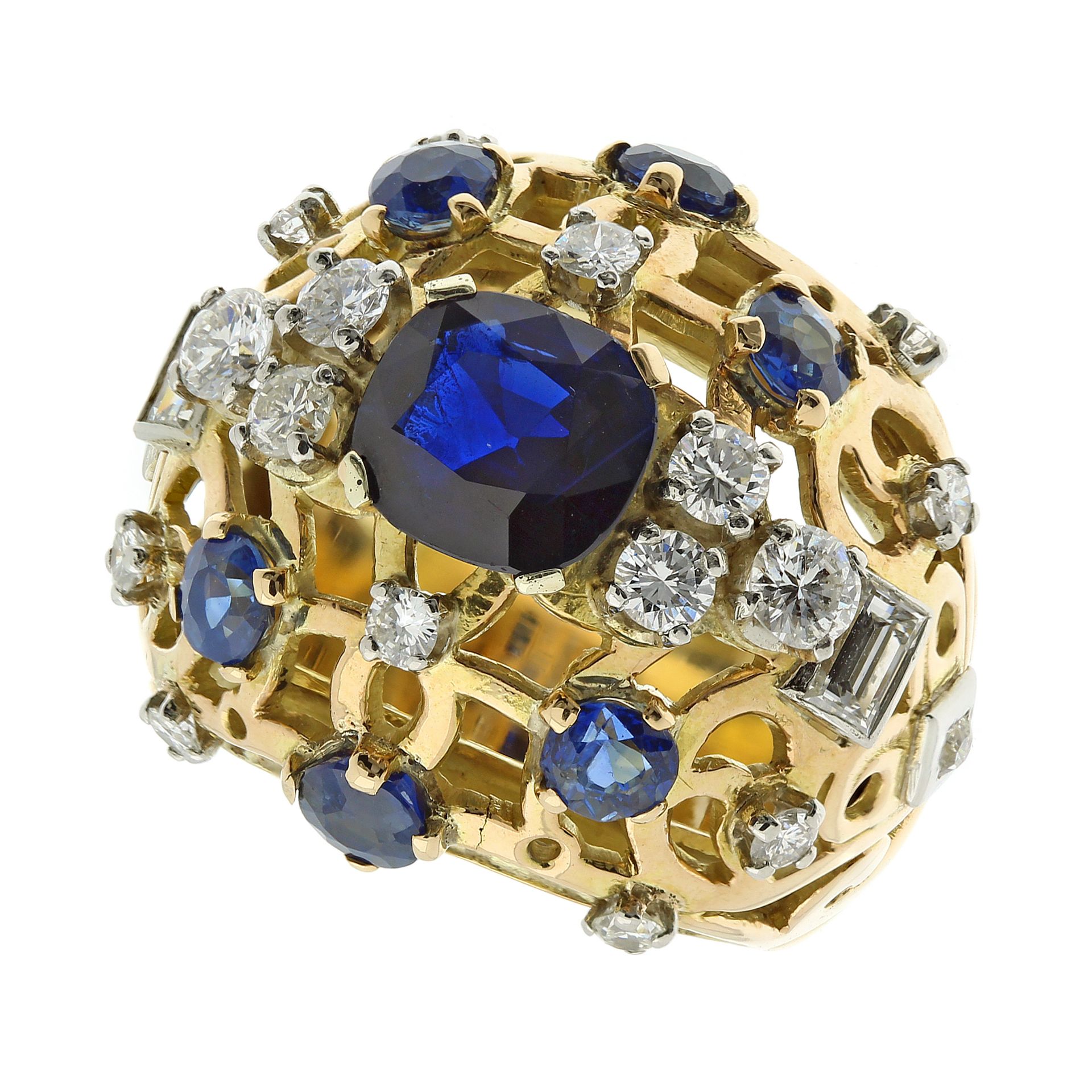 A SAPPHIRE AND DIAMOND COCKTAIL RING in high carat yellow gold, of bombe form, set with a central