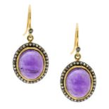 A PAIR OF AMETHYST AND DIAMOND CLUSTER EARRINGS in yellow gold and silver, each set with a large