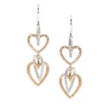 A PAIR OF DIAMOND HEART DROP EARRINGS in white and rose gold, each comprising four graduated,