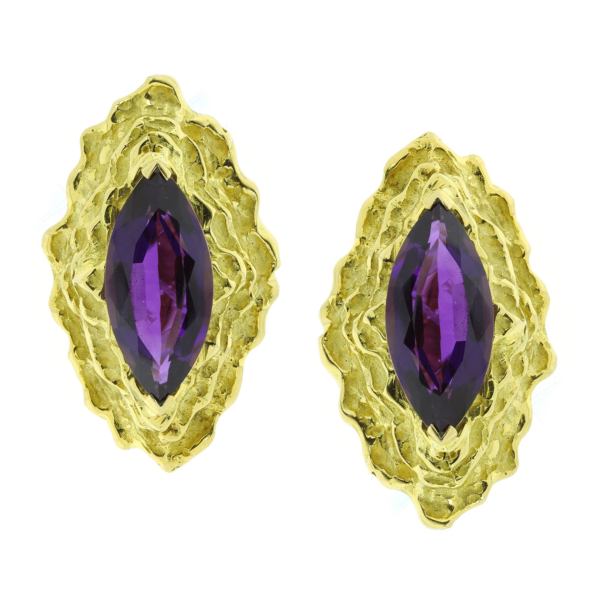 A PAIR OF AMETHYST CLIP EARRINGS CIRCA 1970 in high carat yellow gold each set with a large marquise