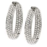 A PAIR OF DIAMOND HOOP EARRINGS in white gold, each hoop jewelled to the front and reverse with