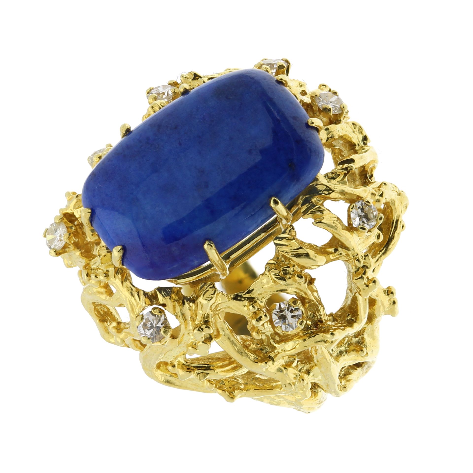 A LAPIS LAZULI AND DIAMOND COCKTAIL RING in a yellow gold textured, naturalistic mount, set with a