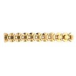 A VINTAGE FANCY LINK BRACELET in 18ct yellow gold, comprising ten geometric links with angular and