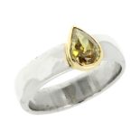 A 0.50 CARAT YELLOW DIAMOND DRESS RING in yellow and white gold, the plain band set with a pear