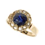 A SAPPHIRE AND DIAMOND CLUSTER RING in high carat yellow gold set with a central old cushion cut