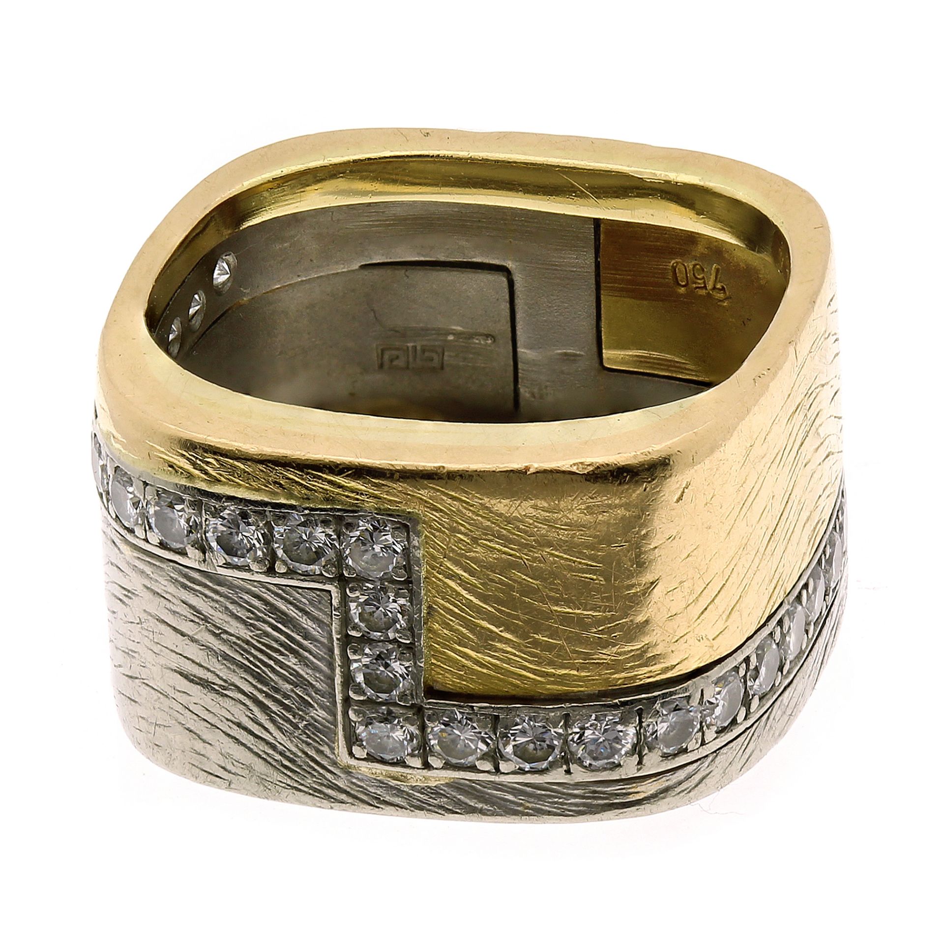 A DIAMOND DRESS RING, PAUL BINDER in 18ct yellow and white gold, the bi-colour band divided by a row