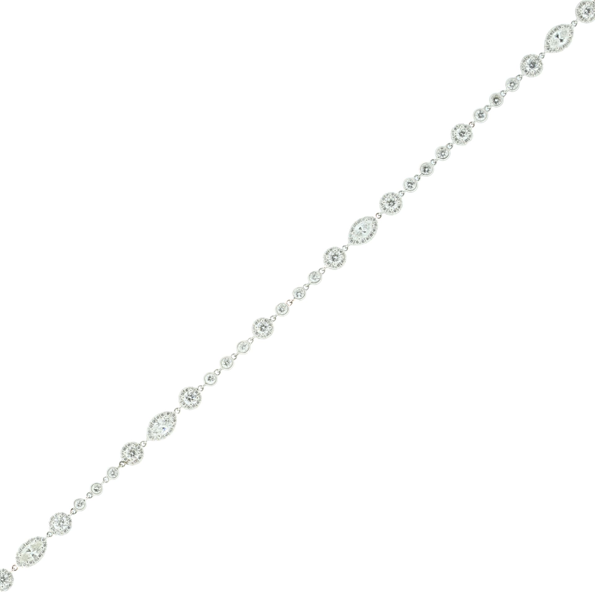 A FANCY LINK DIAMOND NECKLACE in 18ct white gold, the chain formed of bezel set round cut