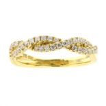 AN INTERWOVEN DIAMOND HALF ETERNITY RING in 18ct yellow gold comprising two interwoven rows of round