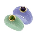 A PAIR OF JADE, PERIDOT AND AMETHYST DRESS RINGS in 14ct yellow gold, each ring carved in jade,