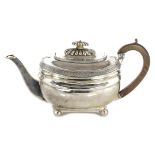 AN ANTIQUE GEORGE III STERLING SILVER TEAPOT BY WILLIAM KING, LONDON 1811 of squat rounded