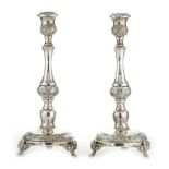 A PAIR OF ANTIQUE JUDAICA SILVER SABBATH CANDLESTICKS, LATE 19TH CENTURY the stylised stems with