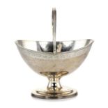 AN ANTIQUE VICTORIAN STERLING SILVER SUGAR BASKET BY WILLIAM STOCKER, LONDON 1860 of navette form,