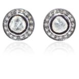 A PAIR OF FLAT CUT DIAMOND CLUSTER EARRINGS in gold and silver, each set with an irregularly