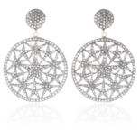 A PAIR OF DIAMOND EARRINGS in gold and silver each designed as a large circular drop with star