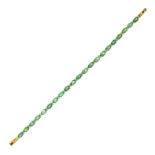 AN EMERALD AND DIAMOND LINE BRACELET in 18ct yellow gold, set with a single row of oval cut emeralds